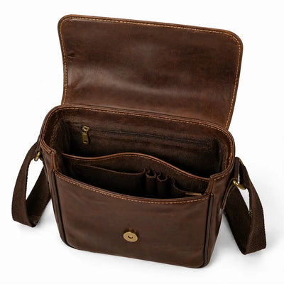 Brown leather bag with open compartments on a white background