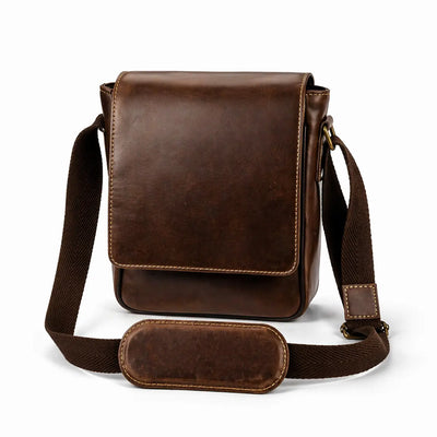 Brown leather crossbody bag on a white background