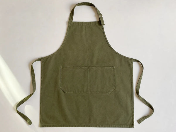 Custom olive bib apron, front flat lay
