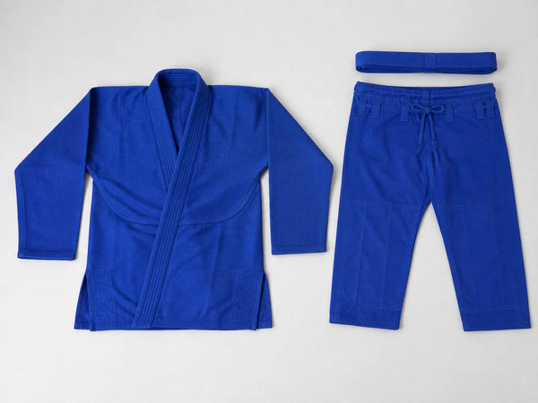 Custom royal blue BJJ gi with jacket, trousers and belt, front flat lay