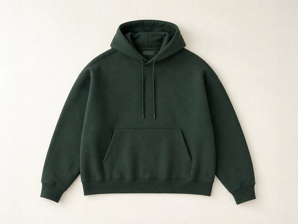 Custom boxy-fit pullover hoodie in forest green heavyweight fleece, front flat lay