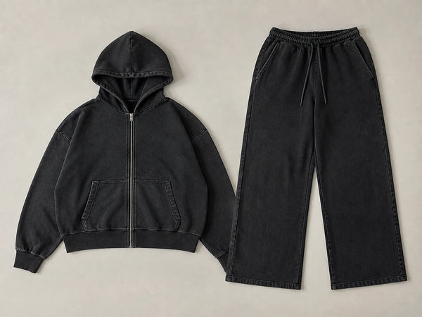 Custom washed black boxy oversized tracksuit with hoodie and pants, front flat lay