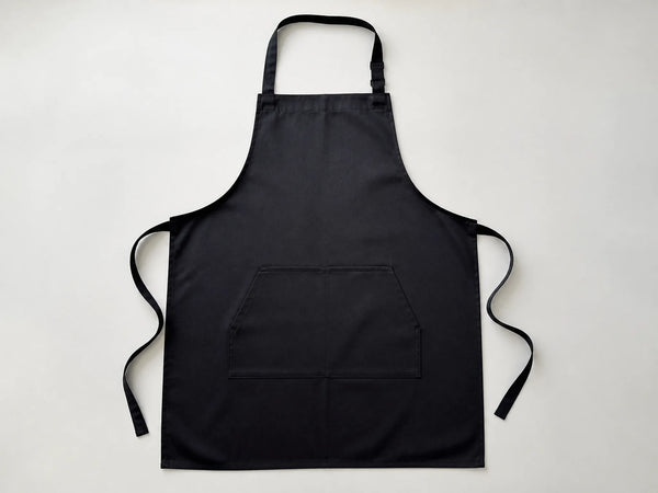 Custom black branding-ready bib apron, front flat lay