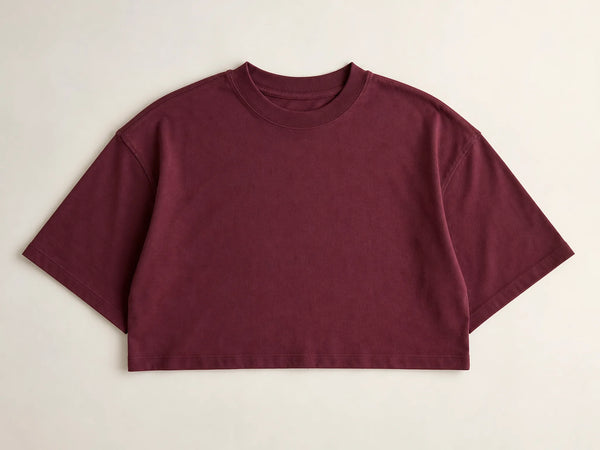 Burgundy custom cropped boxy heavyweight T-shirt laid flat on a light grey background