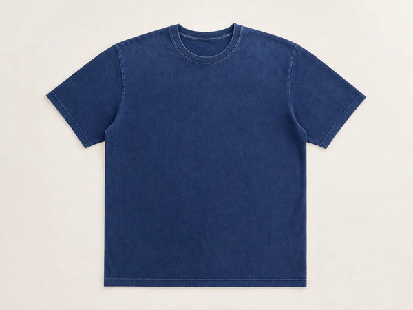 Custom garment-dyed T-shirt in faded indigo cotton, front flat lay