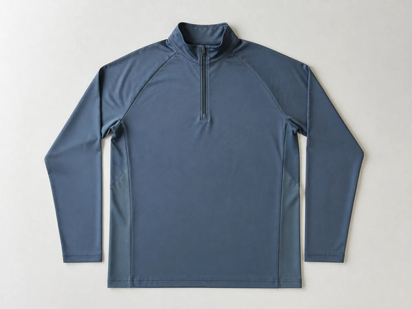 Custom slate blue quarter-zip golf midlayer, front flat lay