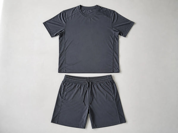 Custom charcoal gym wear set with performance T-shirt and training shorts, front flat lay