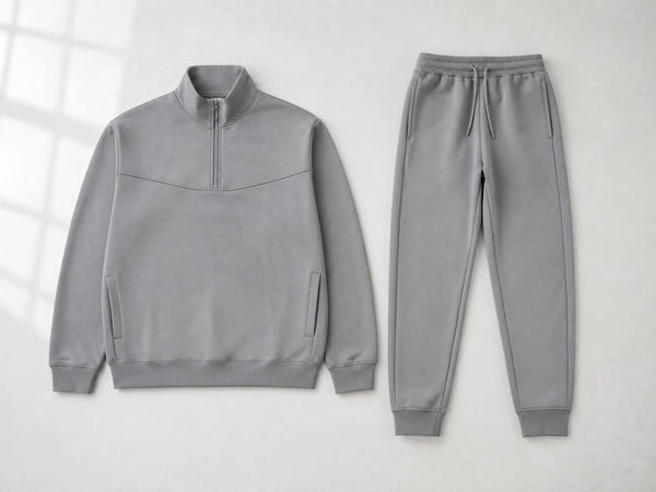Custom stone half-zip tracksuit with pullover top and joggers, front flat lay