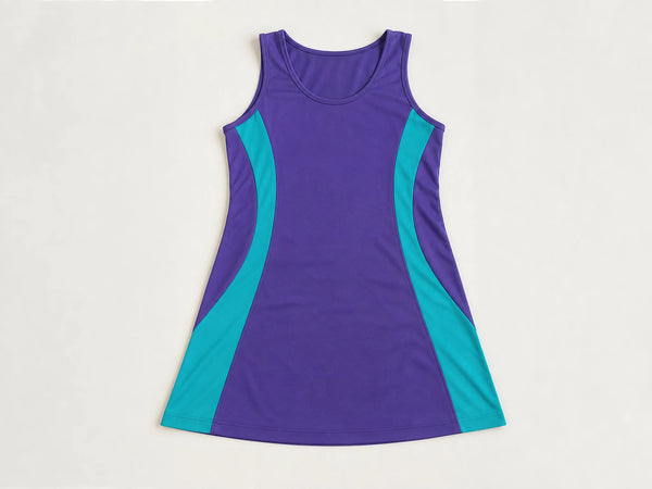 Custom purple and teal netball dress, front flat lay