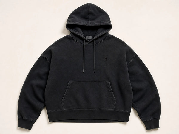 Custom oversized hoodie in washed black with drop shoulders, front flat lay