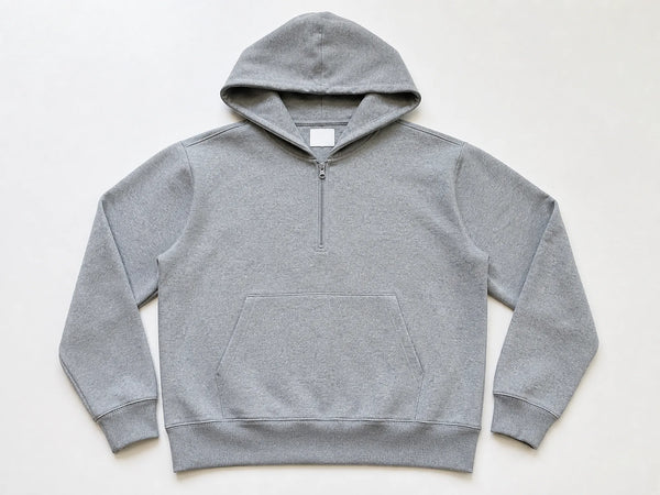 Custom quarter-zip sweatshirt hoodie in heather grey cotton jersey, front flat lay