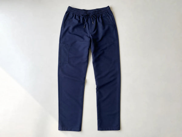 Custom navy scrub trousers, front flat lay