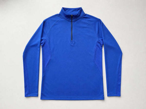 Custom cobalt blue quarter-zip training top, front flat lay