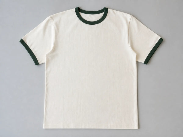 Custom vintage ringer T-shirt with cream body and green trims, front flat lay