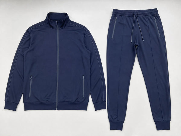 Custom navy zip-up tracksuit with stand-collar jacket and joggers, front flat lay
