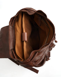 Leather backpack interior layout showing laptop storage zipper pockets and organization